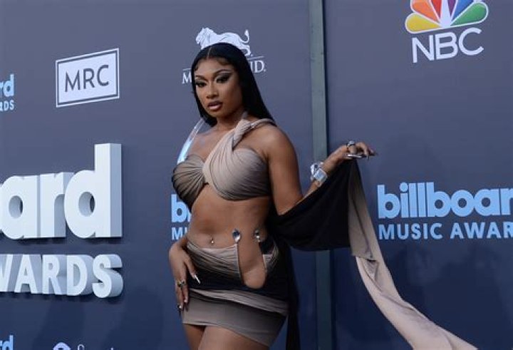 Megan Thee Stallion Wears Eerie Red Contacts & Pink Hair For New Anime-Inspired Look