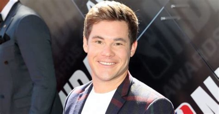 ExclusiveAdam Devine Got ‘Violently Ill For Two Weeks Straight’ After Eating A ‘Toilet Donut’