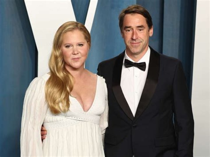 Amy Schumer and Husband Chris Fischer Pack On Major PDA on Oscars 2022 Red Carpet