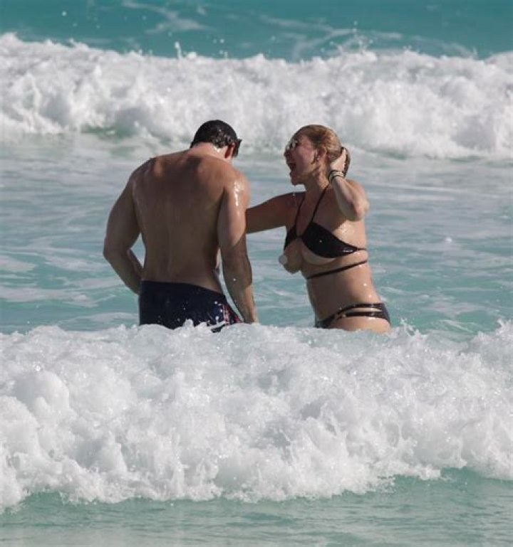 Travis Barker’s Ex Shanna Moakler and Boyfriend Matthew Rondeau Flaunt Their Bodies During Beach Day