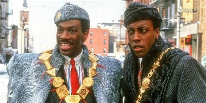 Who sang Queen in the first Coming to America?