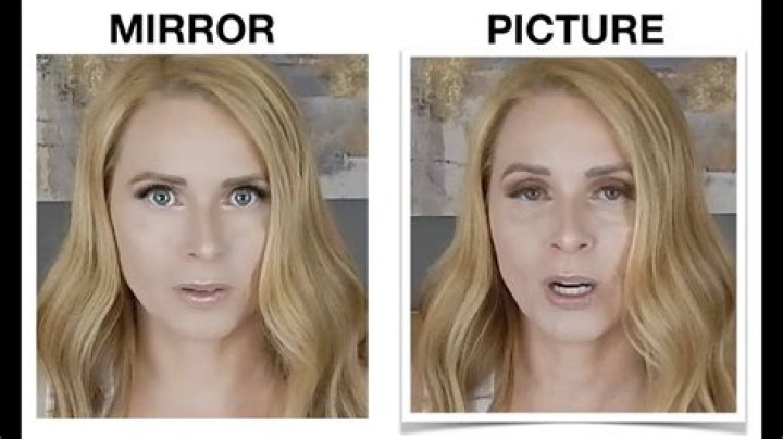 Why do I look uglier in pictures than in the mirror?